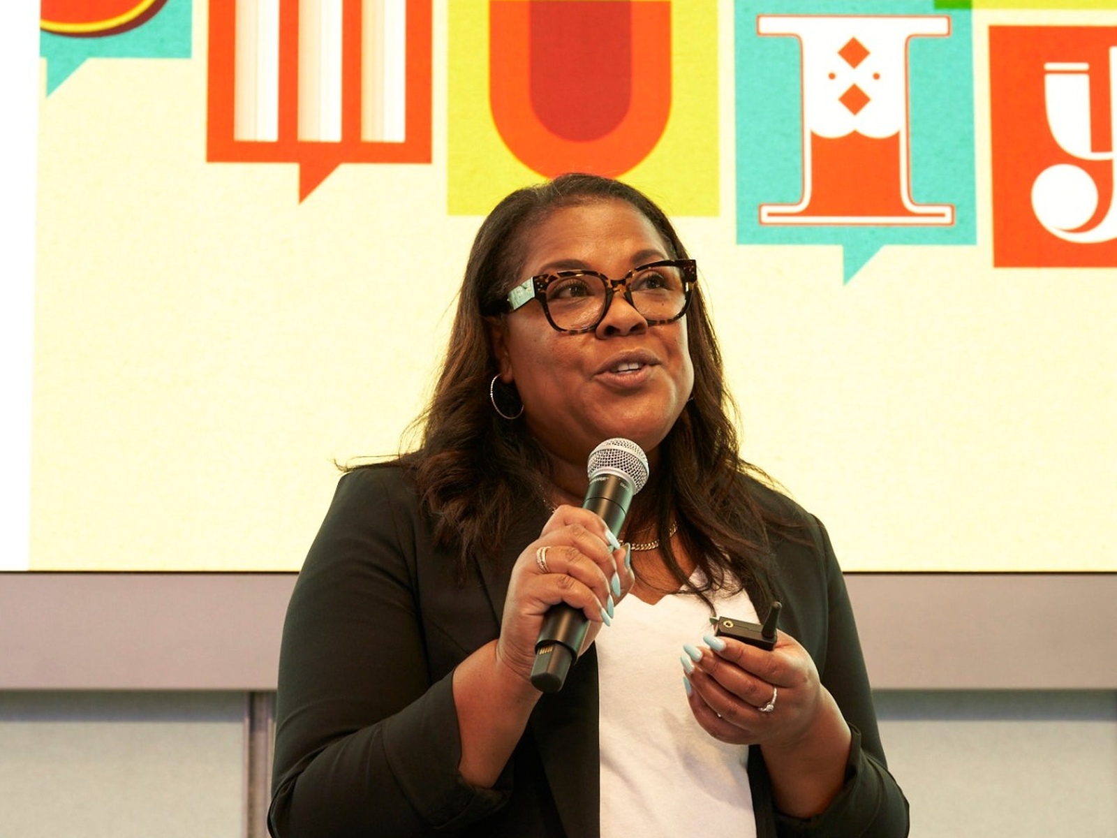 Melaina Chambers speaking at a Meta LA office welcome